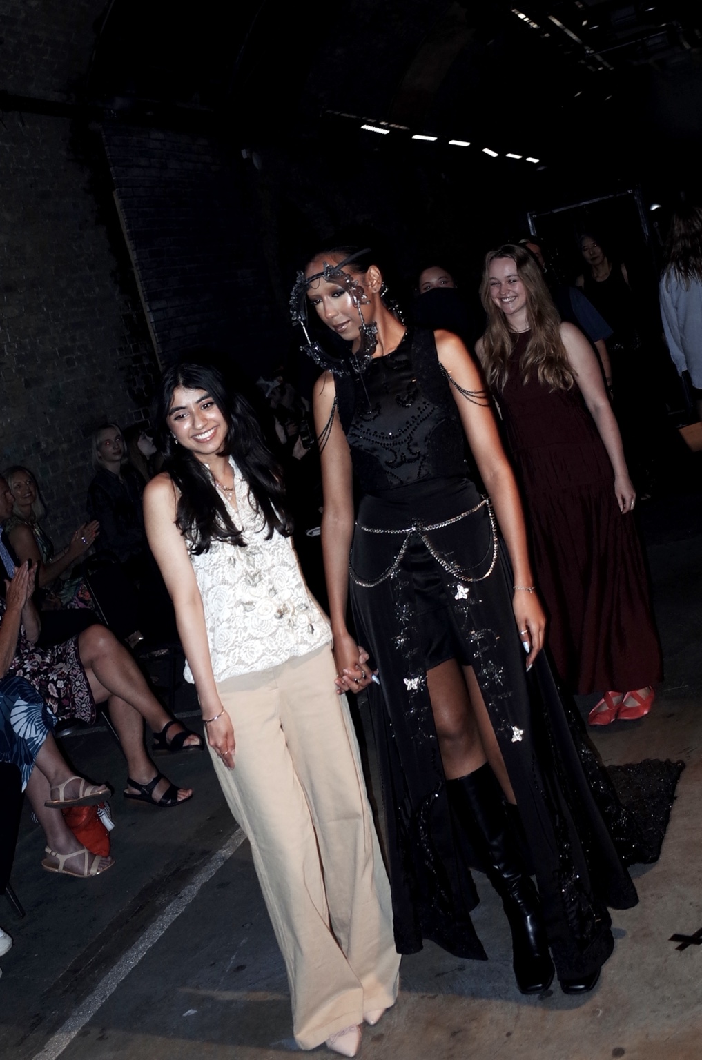 Noir Show, two participants walking together on the runway