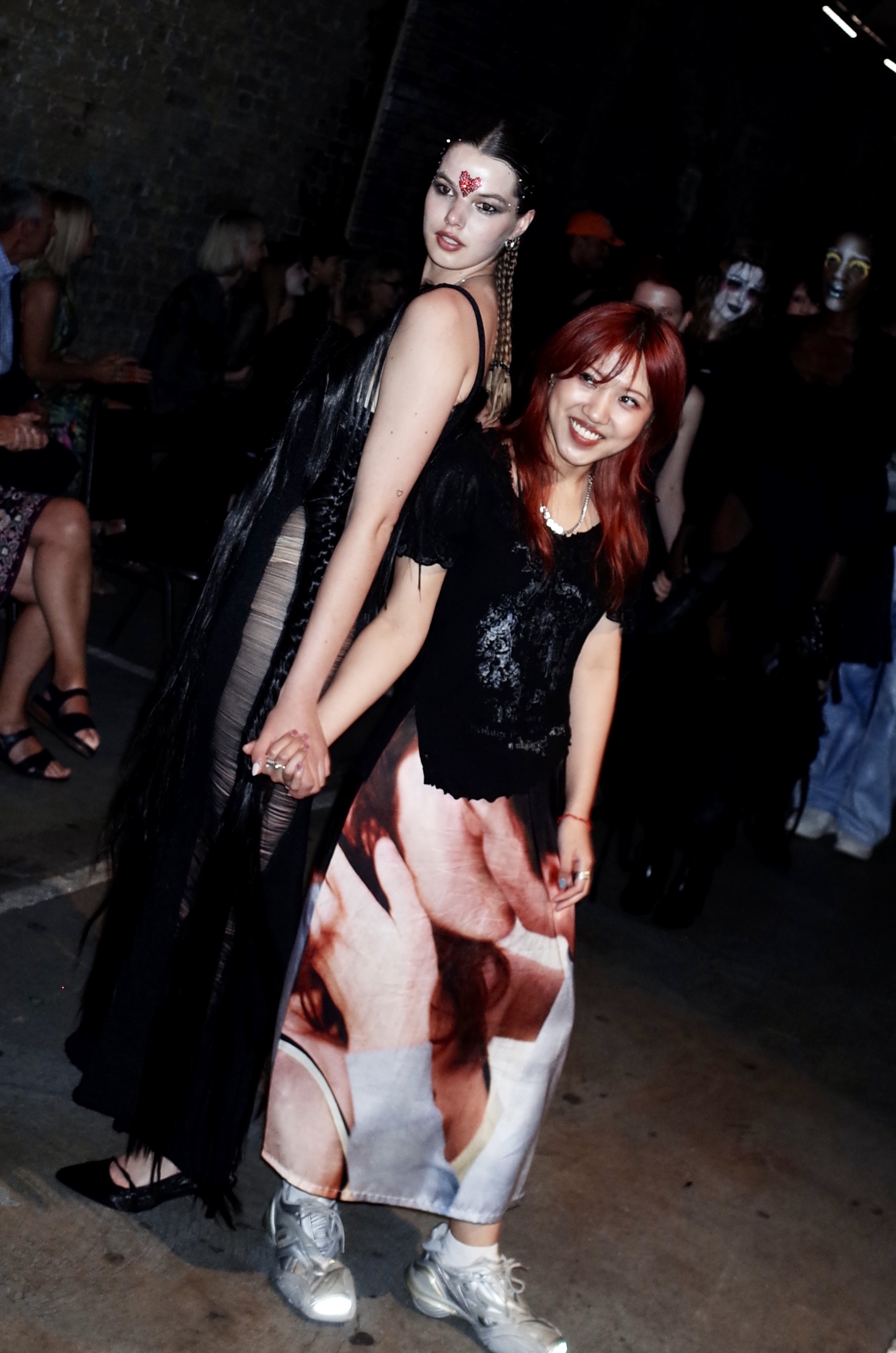 Noir Show, two participants holding hands and smiling