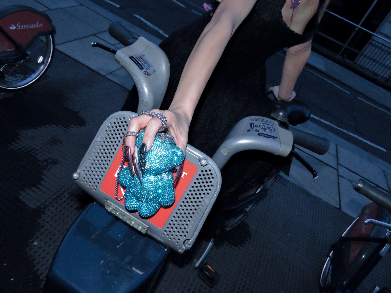 Hand, bag and bicycle detail, London, 26 October 2023