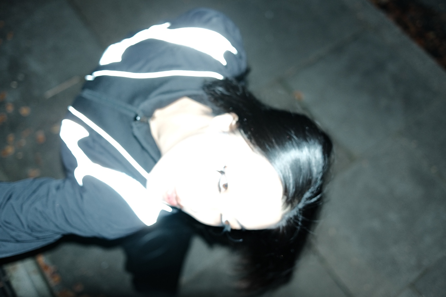 Figure caught by flash and reflective clothing, London, 12 November 2023