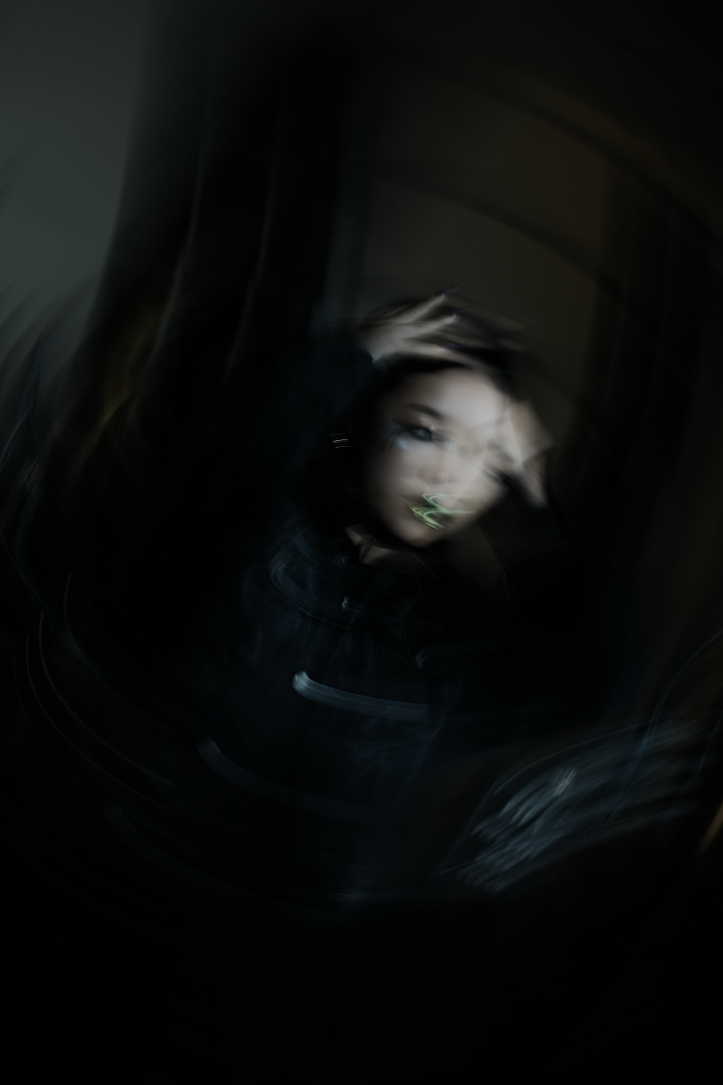 Blurred portrait in low light, London, 12 November 2023