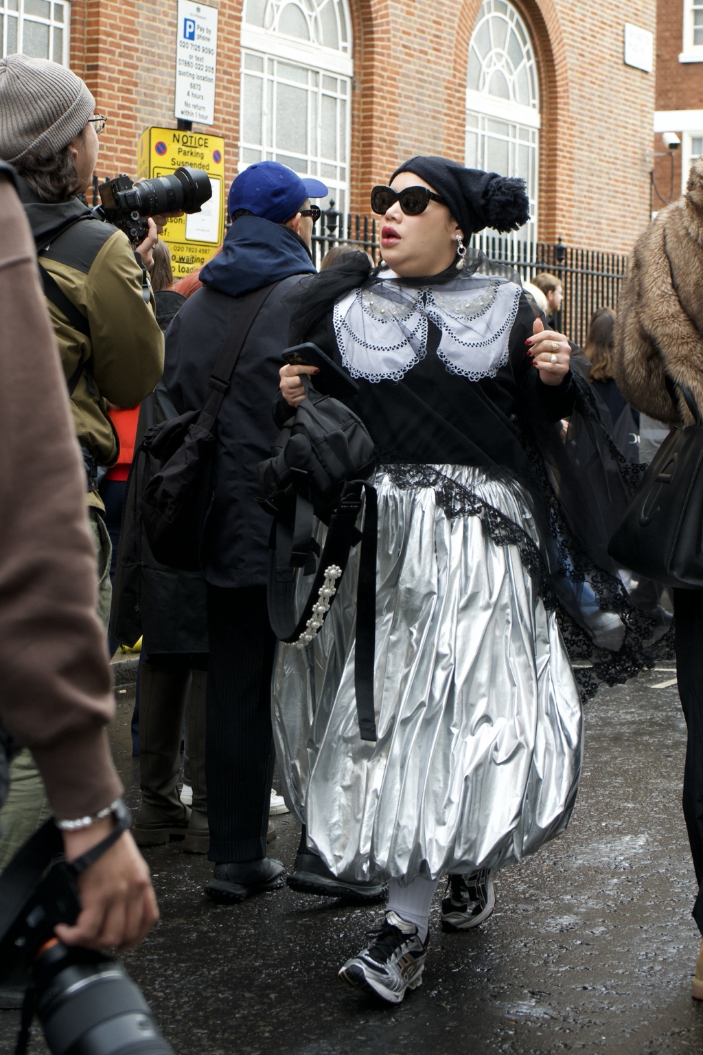 Silver-volume look outside the LOEWE show, London, 18 February 2024