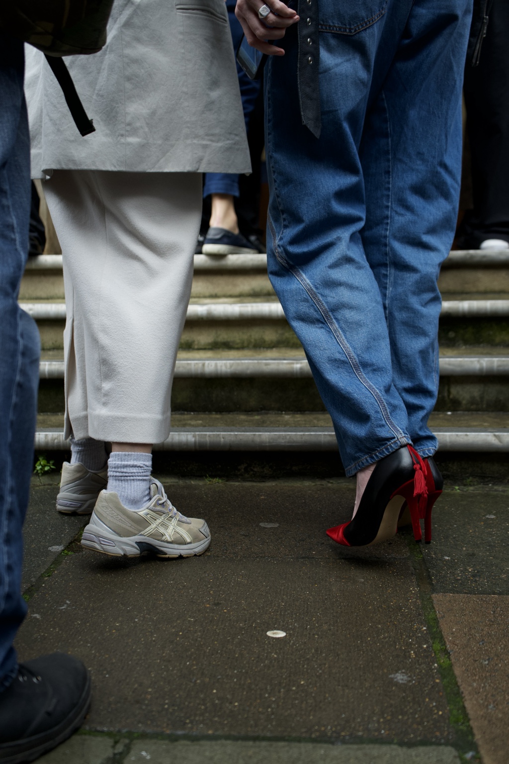 Contrasting shoes and trouser hems outside the LOEWE show, London, 18 February 2024