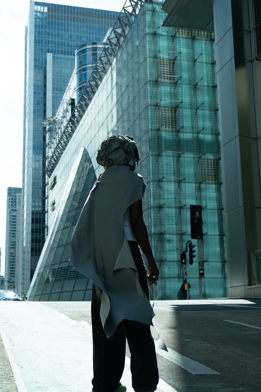 Dressed figure walking through the city, London, 26 April 2024